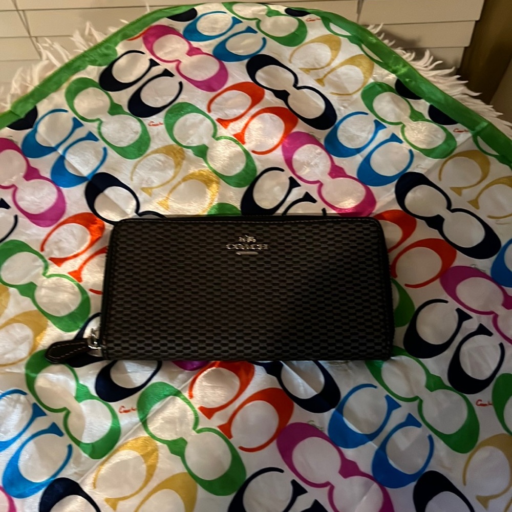 Coach Women’s wallet with credit card pockets on the inside. And coach scarf.